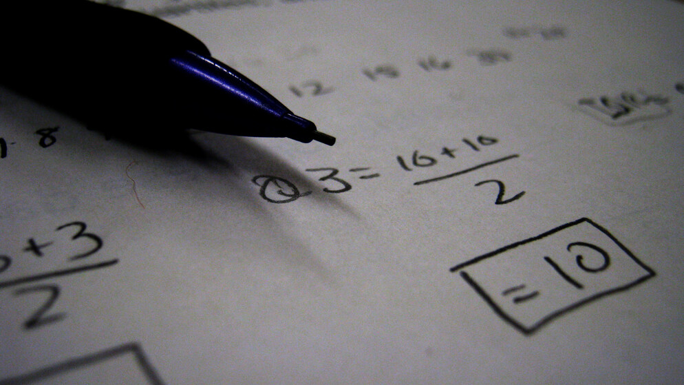 Picture of math equations on a piece of paper